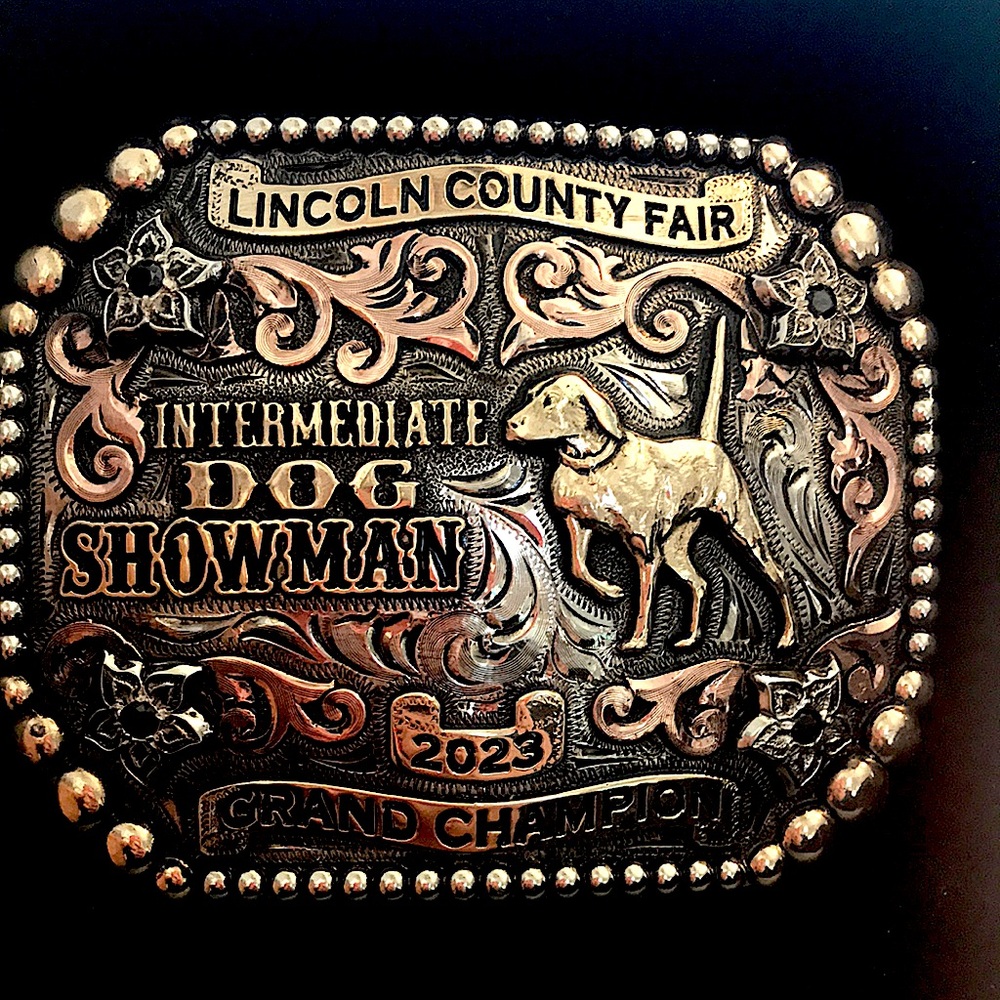 Grand champion Dog showman buckle 
Molly’s custom silver